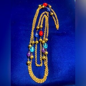 Vintage gold tone colored beaded necklace. 30” flapper length.